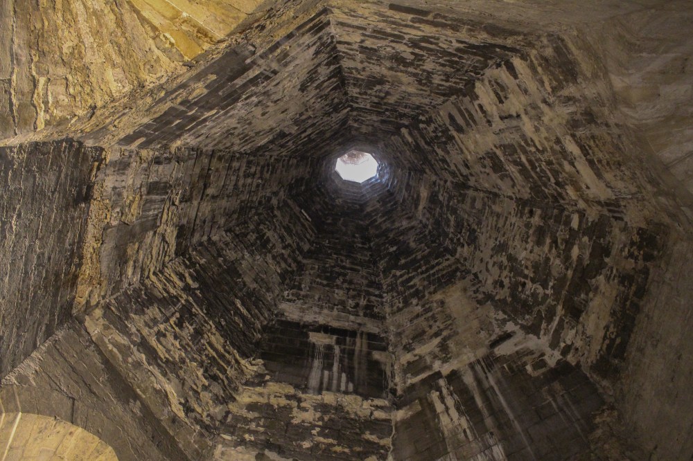 View looking up through the massive fireplace chimney in the kitchen.